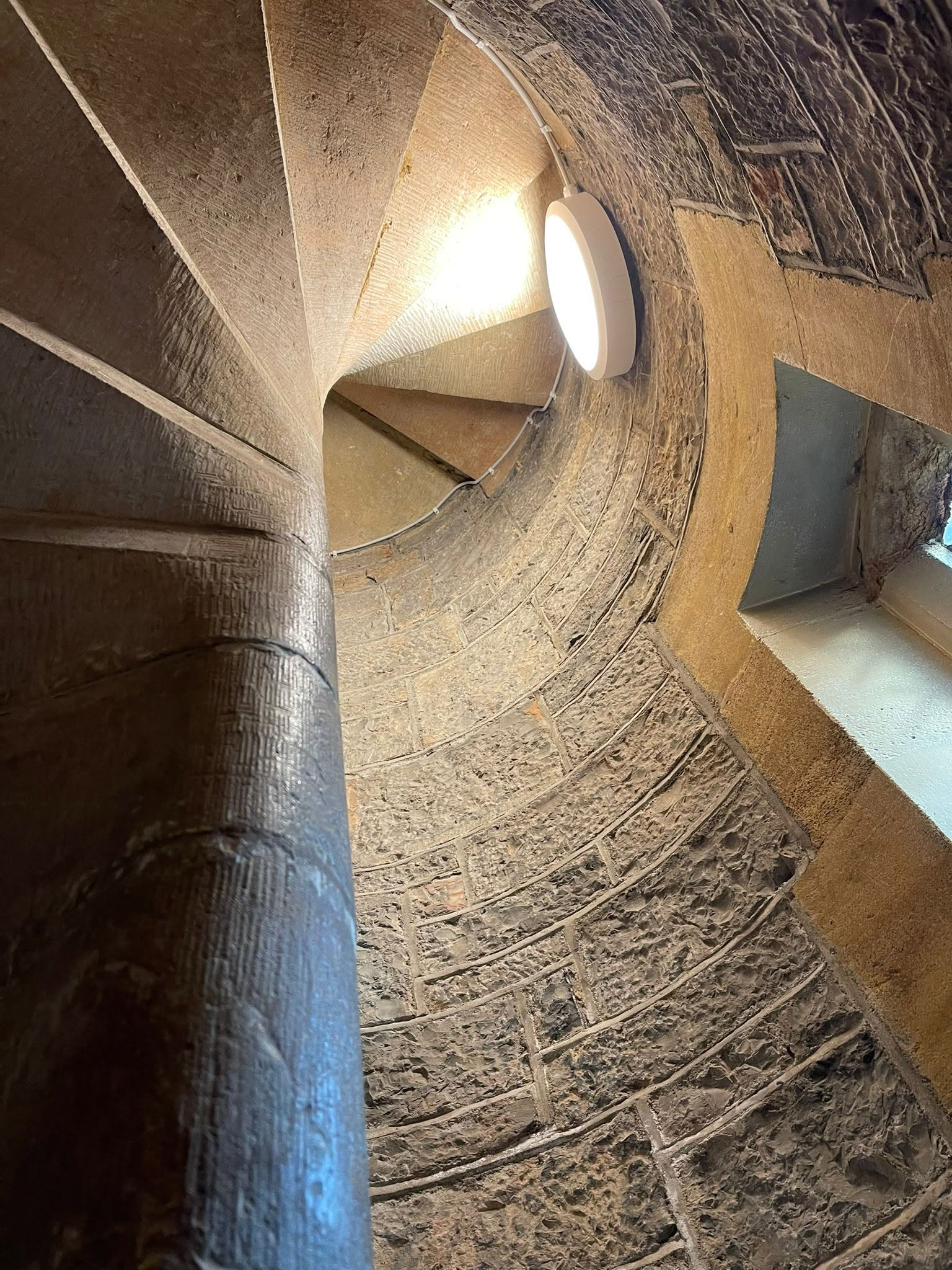 Lighting within a historic stone staircase